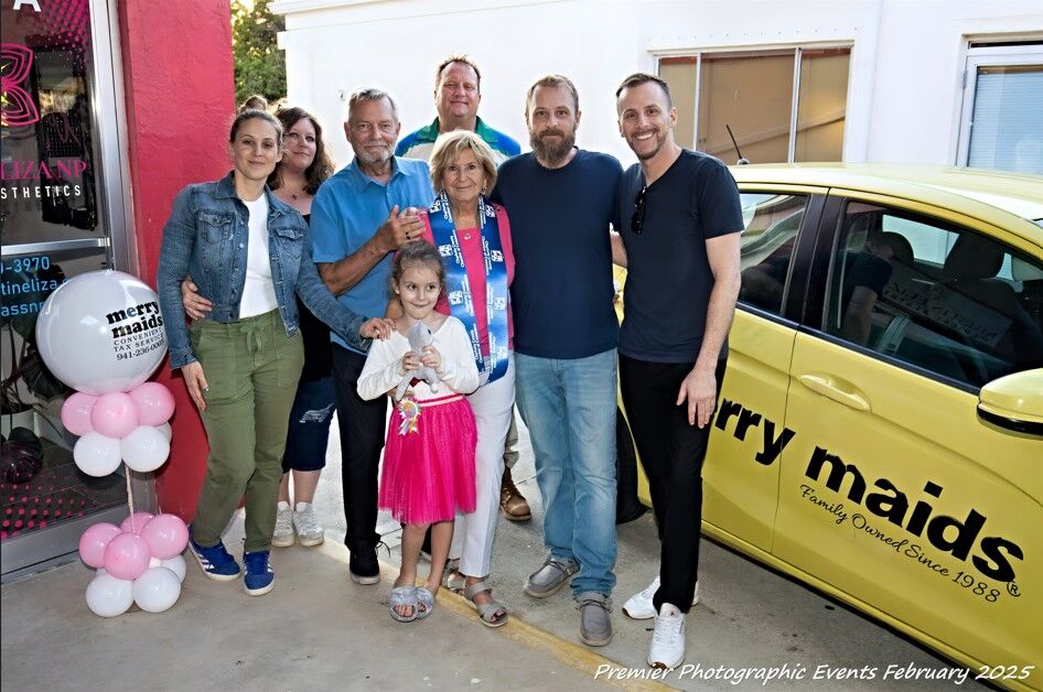 Merry Maids Sue Covington, hubby Dennis Neilson and family